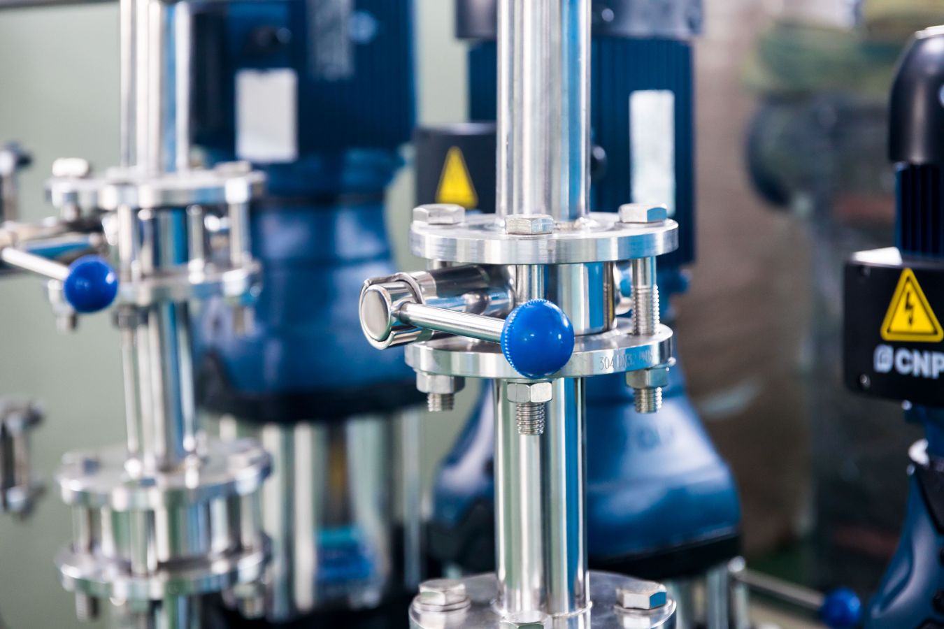 Blue hydraulic valve and industrial pipework